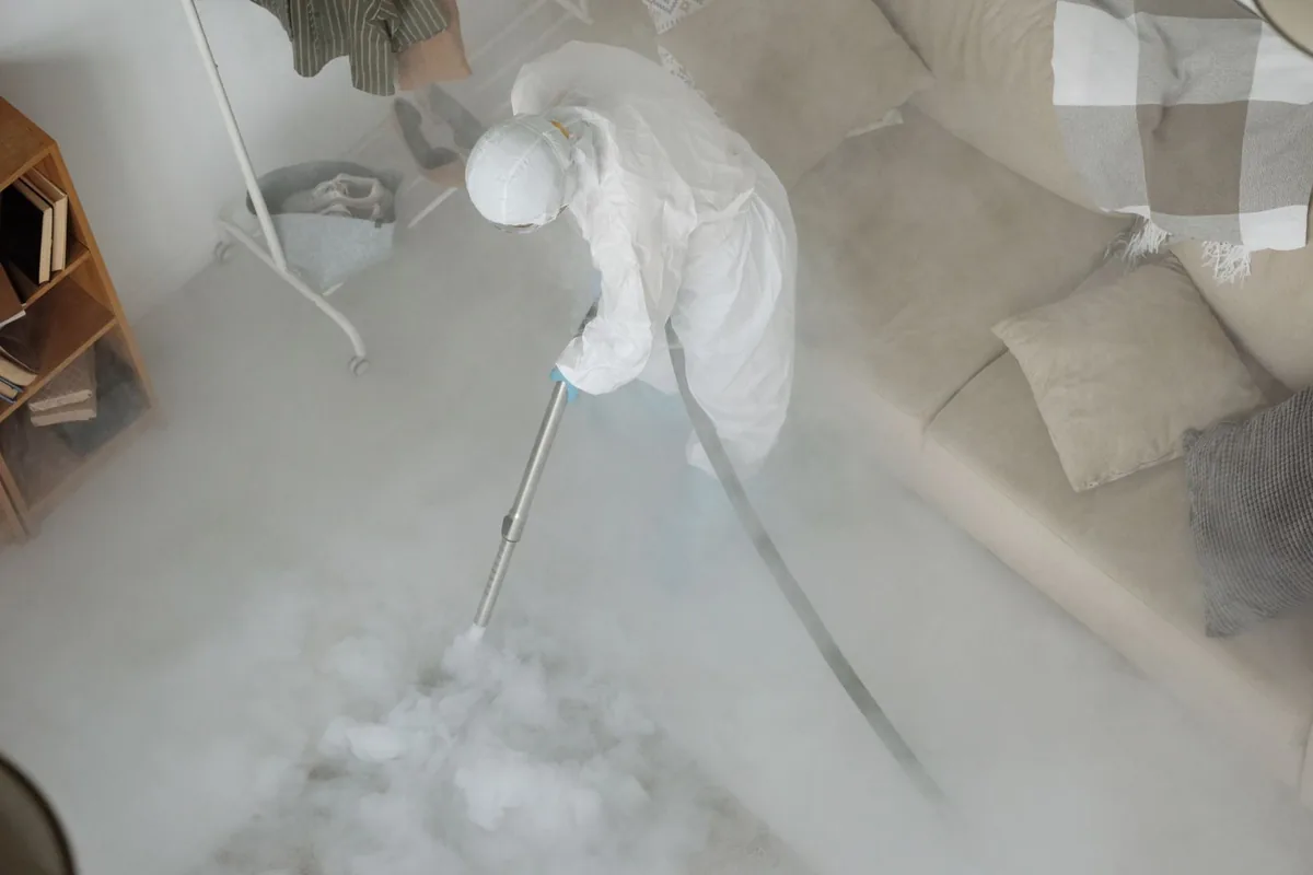 Biohazard cleanup technician in protective equipment, St. Cloud, FL